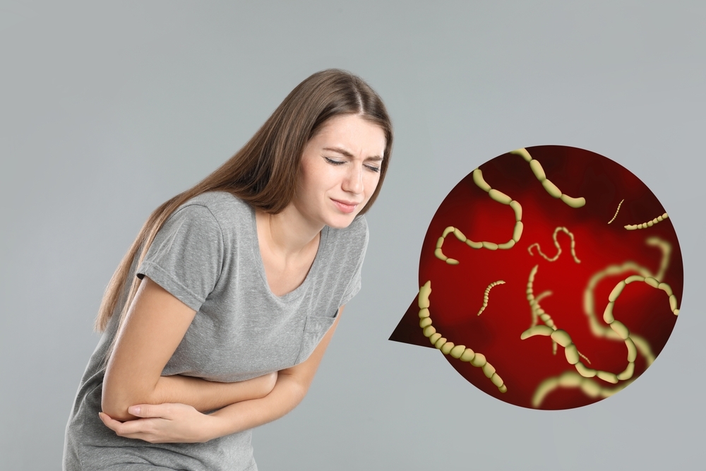 Parasites,Under,Microscope,And,Woman,Suffering,From,Helminthiasis